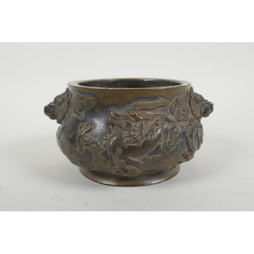 178 - A Chinese bronze censer with dragon mask handles and raised dragon decoration, Xuande 6 character ma... 