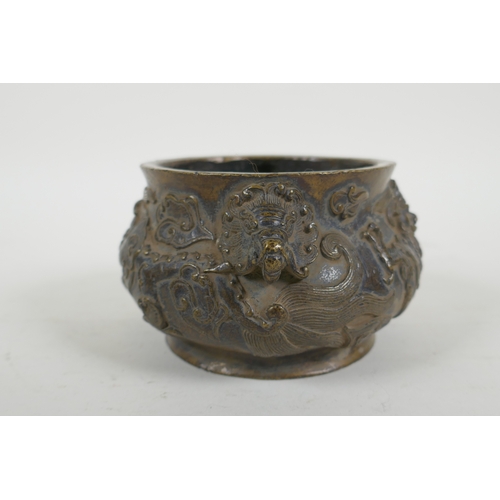 178 - A Chinese bronze censer with dragon mask handles and raised dragon decoration, Xuande 6 character ma... 