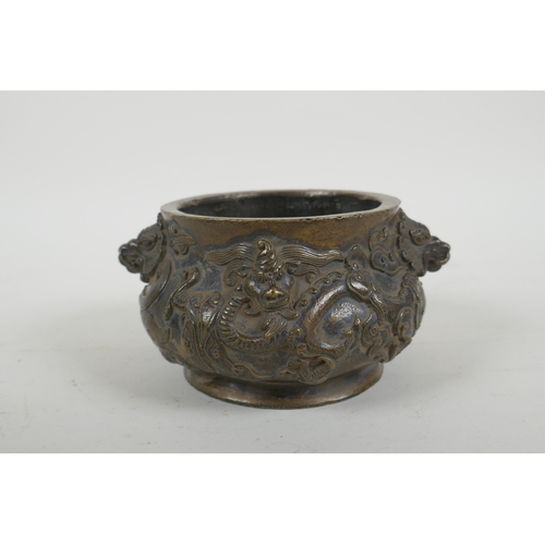 178 - A Chinese bronze censer with dragon mask handles and raised dragon decoration, Xuande 6 character ma... 