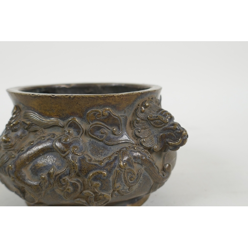 178 - A Chinese bronze censer with dragon mask handles and raised dragon decoration, Xuande 6 character ma... 