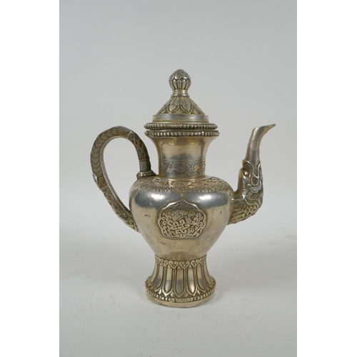 186 - A Tibetan silvered metal coffee /tea pot, double vajra mark to base, 20cm high