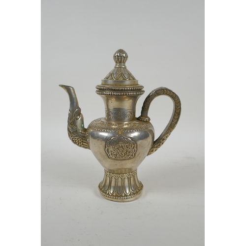 186 - A Tibetan silvered metal coffee /tea pot, double vajra mark to base, 20cm high