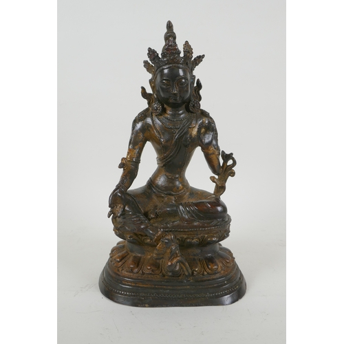 190 - A Sino Tibetan gilt bronzed metal figure of Buddha, 4 character mark to the reverse, 27cm high