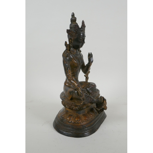 190 - A Sino Tibetan gilt bronzed metal figure of Buddha, 4 character mark to the reverse, 27cm high