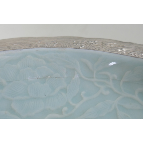 193 - A Chinese celadon ground porcelain dish with lobed rim, and silver glazed details, decorated with a ... 