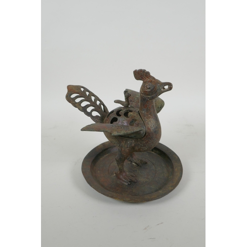 195 - A Chinese archaic style bronzed metal censer in the form of a phoenix standing on a platter, 20cm hi... 