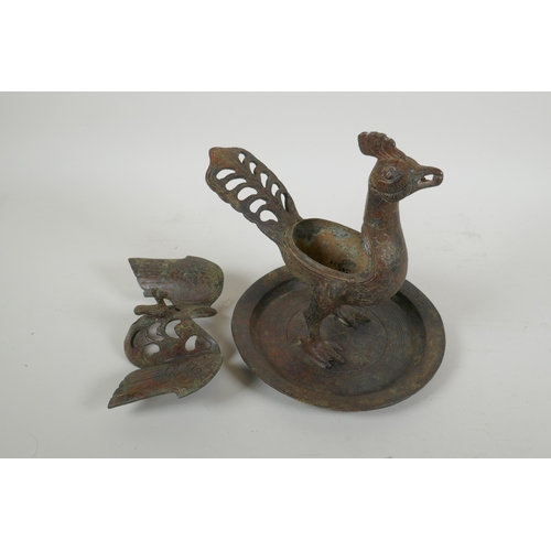 195 - A Chinese archaic style bronzed metal censer in the form of a phoenix standing on a platter, 20cm hi... 