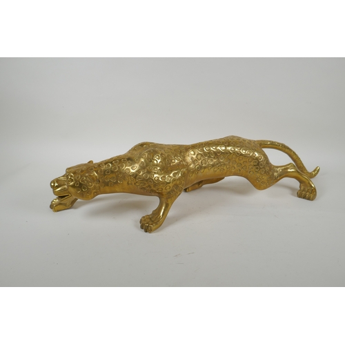 196 - A filled brass prowling leopard, 64cm long