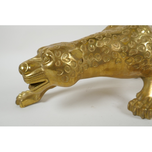 196 - A filled brass prowling leopard, 64cm long