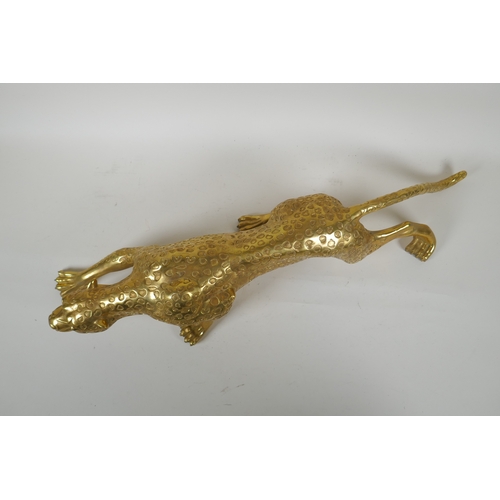 196 - A filled brass prowling leopard, 64cm long