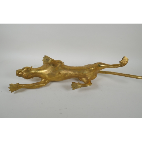 196 - A filled brass prowling leopard, 64cm long