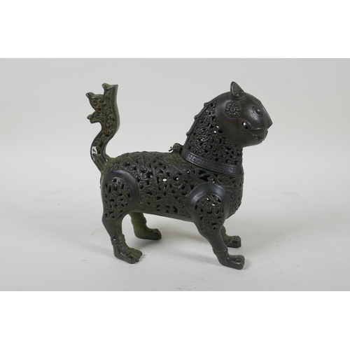 199 - A Persian pierced bronze lion censer and cover, 18cm high