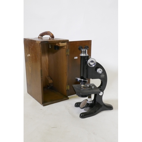 203 - A Beck Ltd of London monocular microscope in wood case, 33cm high