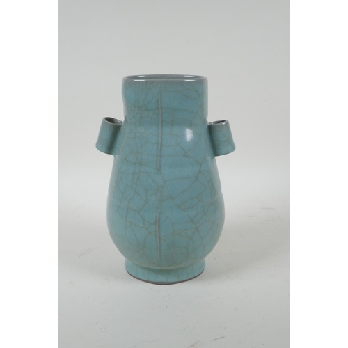 204 - A Chinese celadon ge ware vase with two lug handles, 22cm high