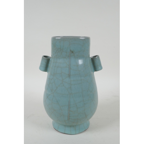 204 - A Chinese celadon ge ware vase with two lug handles, 22cm high