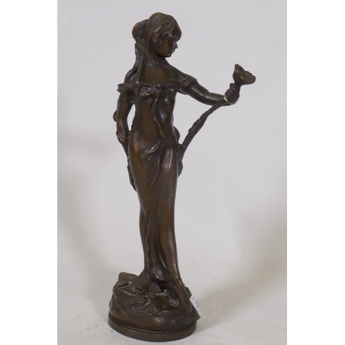 206 - An Art Nouveau style bronze figure of a woman bearing a lily, inscribed Lola, 32cm high