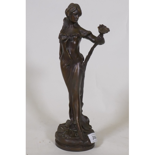 206 - An Art Nouveau style bronze figure of a woman bearing a lily, inscribed Lola, 32cm high