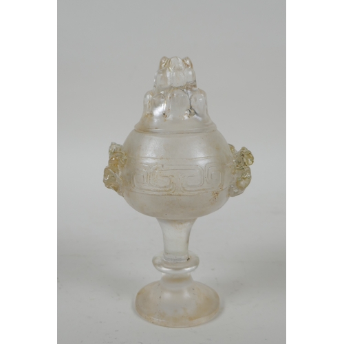 207 - A Chinese moulded glass stem cup/censer and cover with kylin decoration, 15cm high