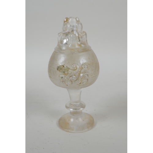 207 - A Chinese moulded glass stem cup/censer and cover with kylin decoration, 15cm high