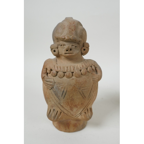 212 - A pre Colombian style pottery ocarina in the form of a frog, and three similar terracotta figures, l... 