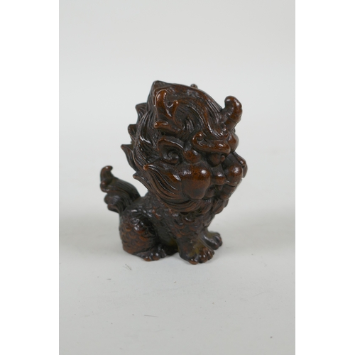 216 - An oriental cast bronze stylised kylin, 6cm high