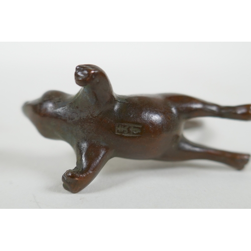 218 - A Japanese style bronze okimono rat, 7cm high