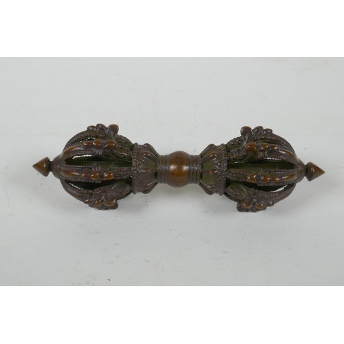 220 - A Tibetan bronze ceremonial vajra, 15cm long