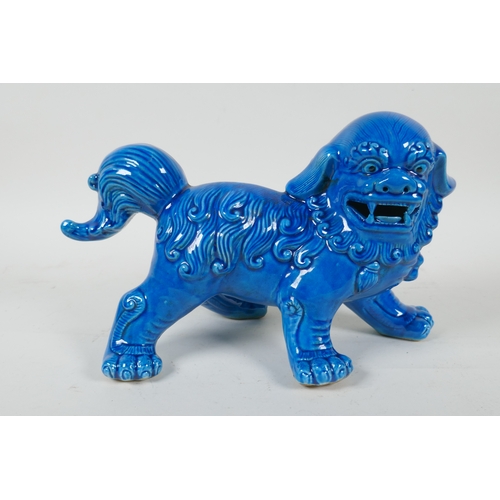 225 - A Chinese turquoise glazed porcelain temple lion, 26cm long