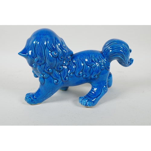 225 - A Chinese turquoise glazed porcelain temple lion, 26cm long