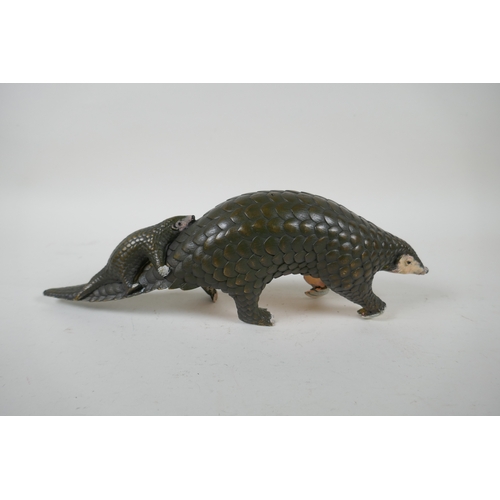 229 - A cold painted bronze pangolin and its offspring, 32cm long