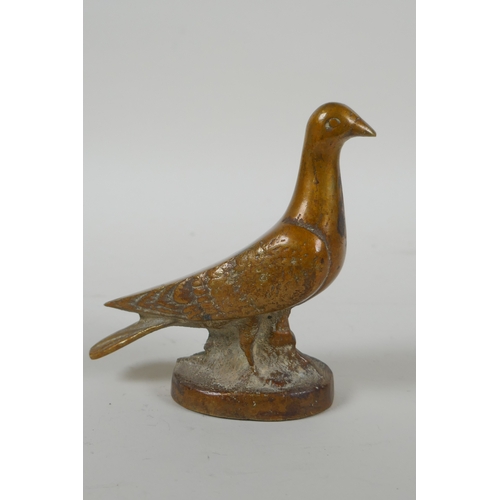 23 - A vintage cast bronze paperweight in the form of a dove, 10cm high