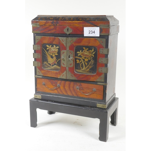 234 - A Meiji lacquered jewellery cabinet on stand with lift up top and four drawers behind two doors over... 