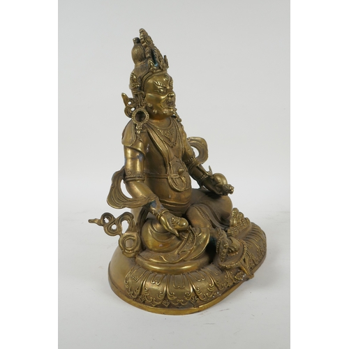 240 - A Tibetan bronze figure of Jambhala, double vajra mark to base, 29cm high