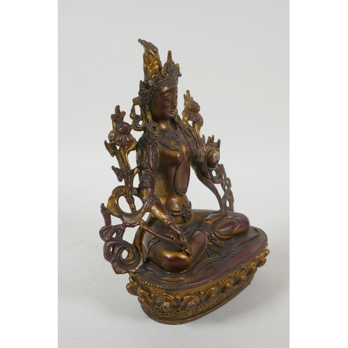 241 - A Sino Tibetan gilt and coppered bronze of the Green Tara, 20cm high