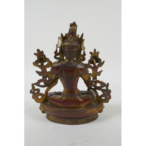 241 - A Sino Tibetan gilt and coppered bronze of the Green Tara, 20cm high