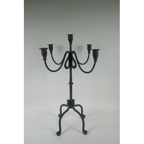 243 - A painted wrought metal four branch candelabra, 59cm high