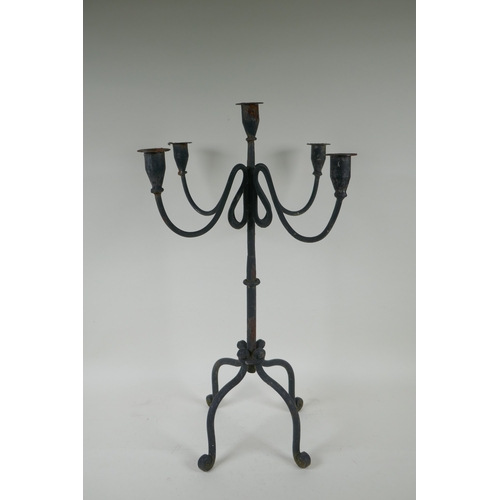 243 - A painted wrought metal four branch candelabra, 59cm high