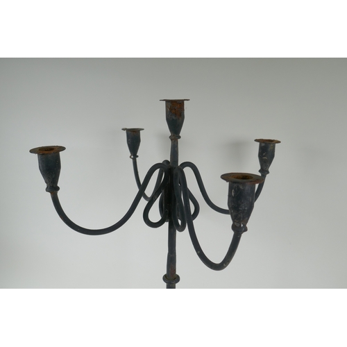 243 - A painted wrought metal four branch candelabra, 59cm high