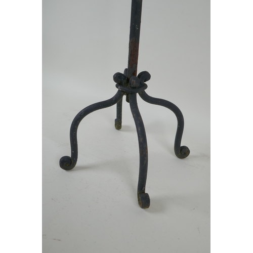 243 - A painted wrought metal four branch candelabra, 59cm high