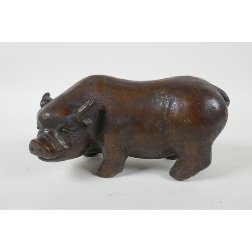 244 - A filled bronze model of a sow, 19cm  long