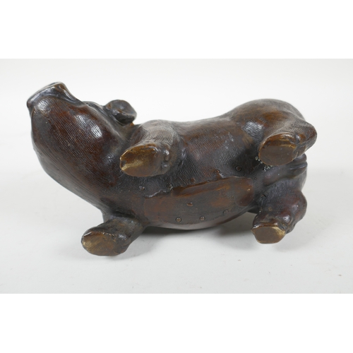 244 - A filled bronze model of a sow, 19cm  long