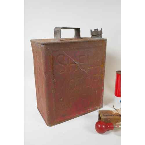 25 - A vintage Shell Motor Spirit petrol can, an Esso one quart glass oil bottle, a can of Esso Brake &am... 