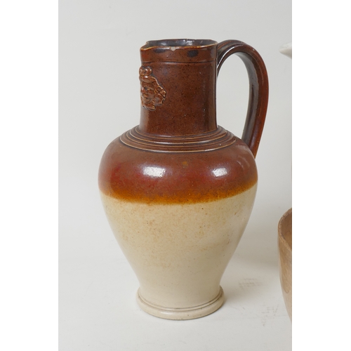 255 - A Doulton Lambeth jug, two lustre jugs, and a Mocha ware jug, 17cm high, and a bowl