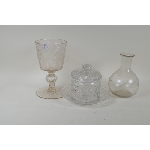 256 - A Victorian cut glass jar and cover with dish, a carafe and etched goblet, 22cm high