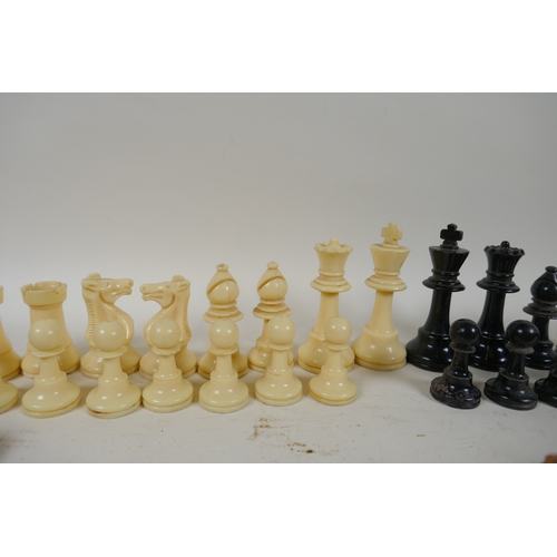 260 - A box wood and ebony chess set, king 7cm high, and an early C20th composition set, king 9cm high, bo... 