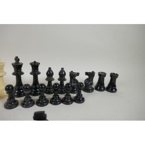 260 - A box wood and ebony chess set, king 7cm high, and an early C20th composition set, king 9cm high, bo... 