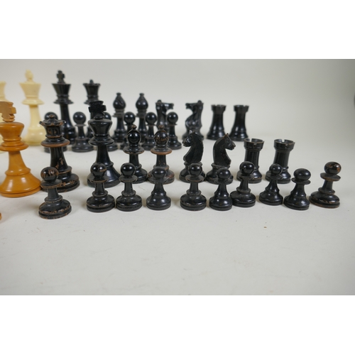 260 - A box wood and ebony chess set, king 7cm high, and an early C20th composition set, king 9cm high, bo... 