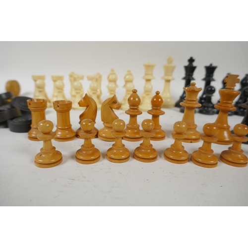 260 - A box wood and ebony chess set, king 7cm high, and an early C20th composition set, king 9cm high, bo... 