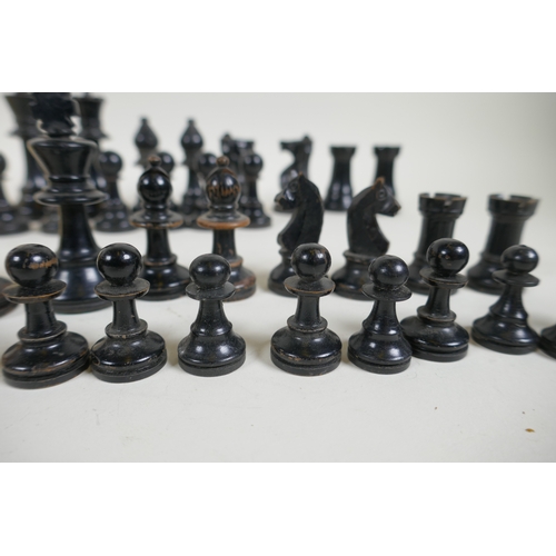 260 - A box wood and ebony chess set, king 7cm high, and an early C20th composition set, king 9cm high, bo... 