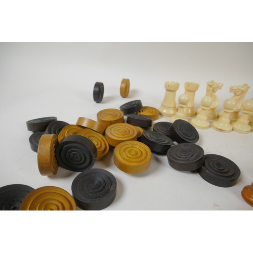 260 - A box wood and ebony chess set, king 7cm high, and an early C20th composition set, king 9cm high, bo... 